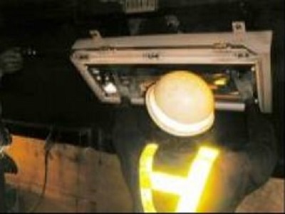 Photo of tunnel lighting equipment cleaning and inspection