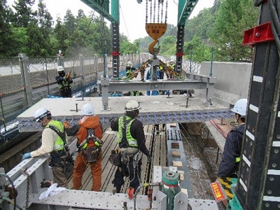 Photograph of new floor slab erection by gate type erection machine