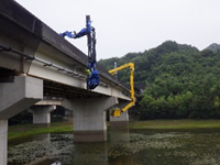Photos of the use of bridge inspection vehicles