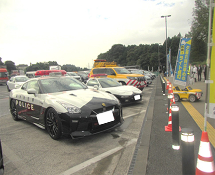 Image of patrol cars and other items on display