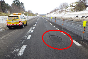 Photo of road surface damage example