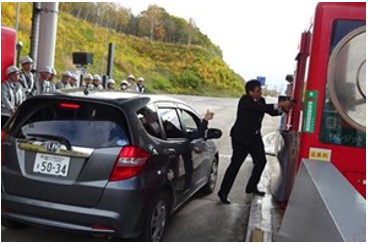 A picture of a robbery attacking a toll booth
